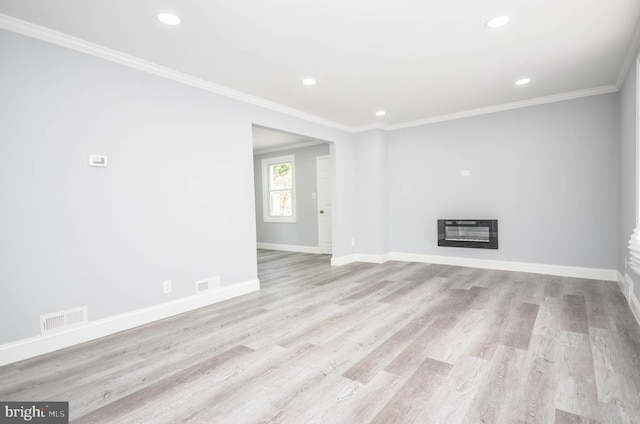 7009 Adelphi Rd, Hyattsville, MD 20782 - unfurnished living room with baseboards, wood finished floors, a glass covered fireplace, ornamental molding, and recessed lighting