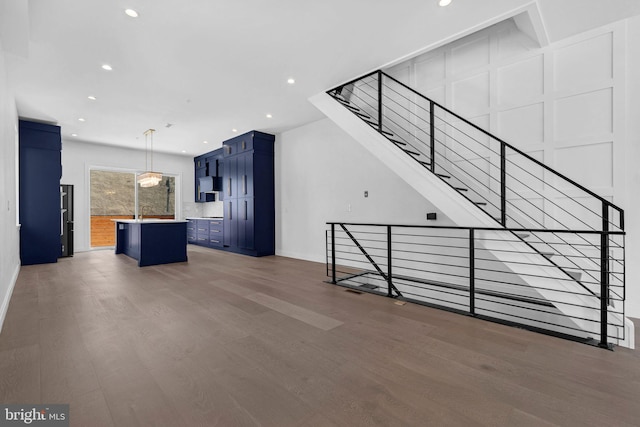 1615 S 22nd St, Philadelphia, PA 19145 - unfurnished living room with wood finished floors, recessed lighting, a sink, and baseboards
