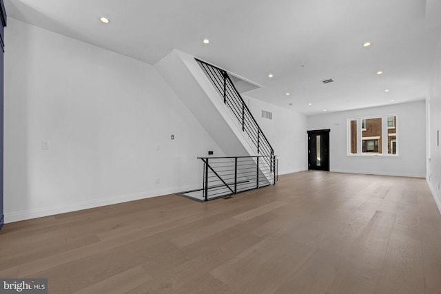 1615 S 22nd St, Philadelphia, PA 19145 - unfurnished living room featuring wood finished floors, stairway, recessed lighting, and baseboards