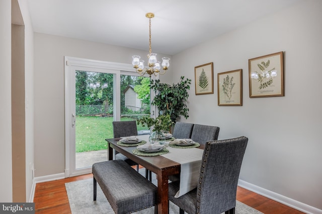 808 Gregorio Dr, Silver Spring, MD 20901 - dining room with a chandelier, wood finished floors, and baseboards