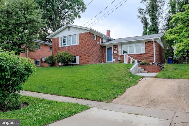 808 Gregorio Dr, Silver Spring, MD 20901 - tri-level home with brick siding, a front yard, and a chimney