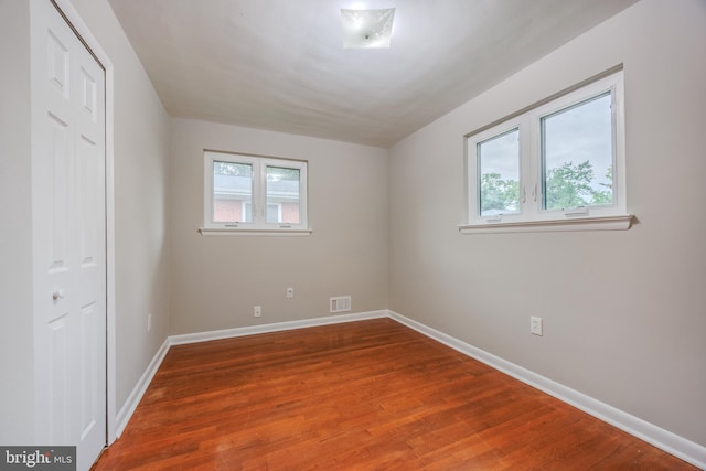 808 Gregorio Dr, Silver Spring, MD 20901 - unfurnished bedroom with wood finished floors, baseboards, and a closet