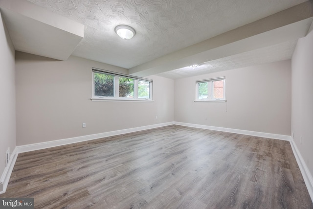 808 Gregorio Dr, Silver Spring, MD 20901 - spare room with wood finished floors, baseboards, and a textured ceiling