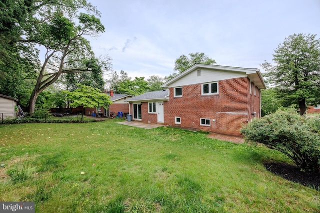 808 Gregorio Dr, Silver Spring, MD 20901 - rear view of house featuring brick siding and a patio area