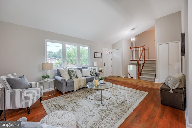 808 Gregorio Dr, Silver Spring, MD 20901 - living room with vaulted ceiling, stairway, and wood finished floors