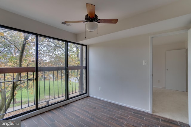 10300 Bushman Dr Unit 209, Oakton, VA 22124 - empty room featuring ceiling fan, baseboards, and dark wood-style floors