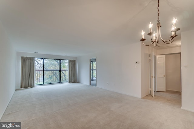 10300 Bushman Dr Unit 209, Oakton, VA 22124 - empty room featuring a chandelier and light colored carpet