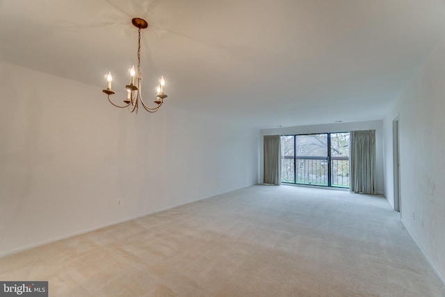 10300 Bushman Dr Unit 209, Oakton, VA 22124 - carpeted spare room featuring a chandelier