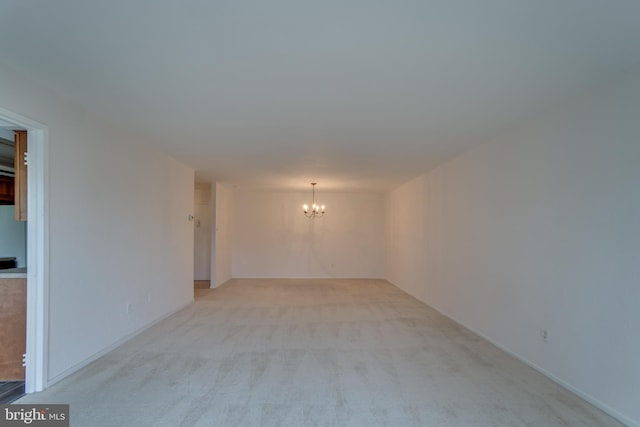 10300 Bushman Dr Unit 209, Oakton, VA 22124 - unfurnished room featuring a chandelier and light carpet