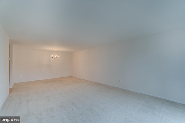 10300 Bushman Dr Unit 209, Oakton, VA 22124 - empty room featuring a chandelier and light colored carpet