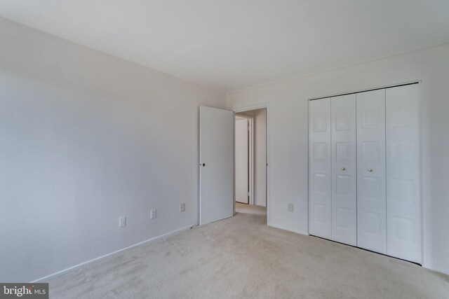 10300 Bushman Dr Unit 209, Oakton, VA 22124 - unfurnished bedroom featuring carpet flooring and a closet