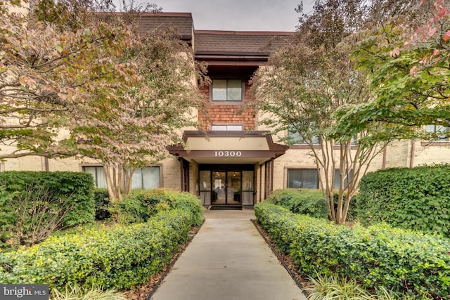 10300 Bushman Dr Unit 209, Oakton, VA 22124 - property entrance featuring french doors and brick siding