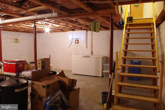 13920 Heavenly Acres Rdg, Hancock, MD 21750 - unfinished basement featuring refrigerator, concrete block wall, and stairs