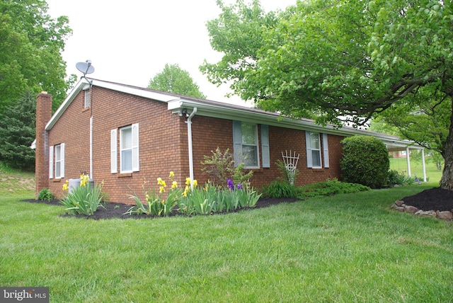 13920 Heavenly Acres Rdg, Hancock, MD 21750 - view of side of property featuring a yard, brick siding, a chimney, and central AC
