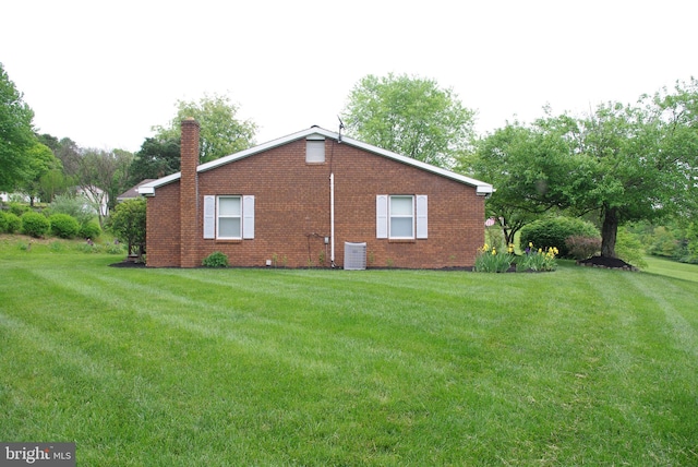 13920 Heavenly Acres Rdg, Hancock, MD 21750 - view of side of home featuring a chimney, central AC, a lawn, and brick siding