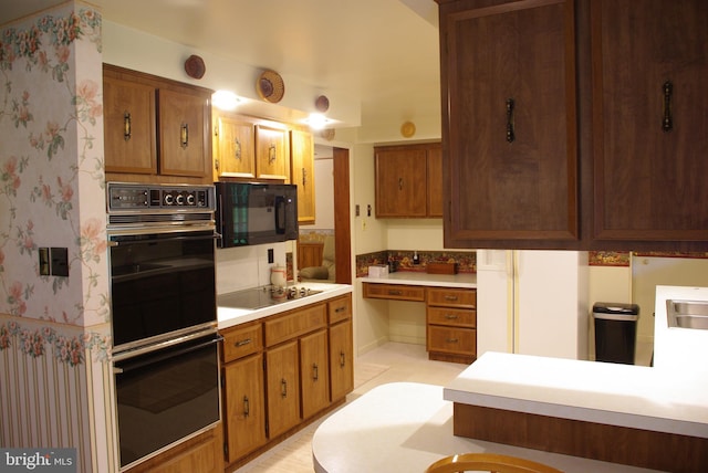 13920 Heavenly Acres Rdg, Hancock, MD 21750 - kitchen featuring black appliances, light countertops, wallpapered walls, and brown cabinets