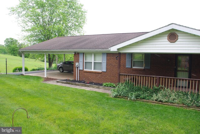 13920 Heavenly Acres Rdg, Hancock, MD 21750 - view of front facade with brick siding, an attached carport, a front yard, and roof with shingles