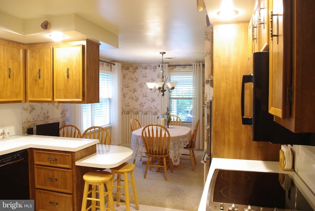 13920 Heavenly Acres Rdg, Hancock, MD 21750 - kitchen with wallpapered walls, black appliances, healthy amount of natural light, light countertops, and brown cabinetry