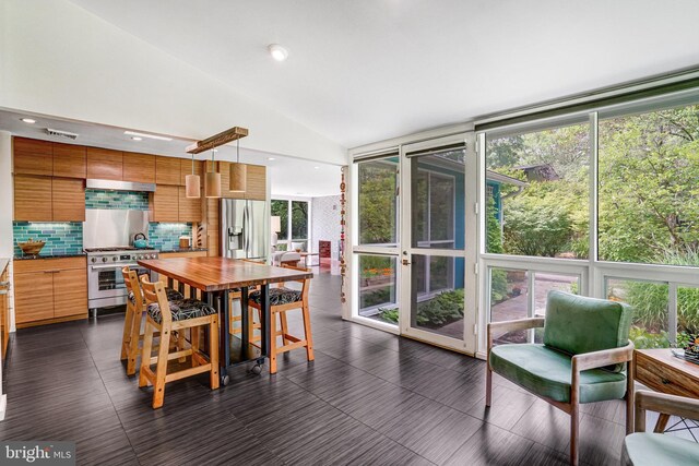 1937 Marthas Rd, Alexandria, VA 22307 - dining space with lofted ceiling, expansive windows, and recessed lighting
