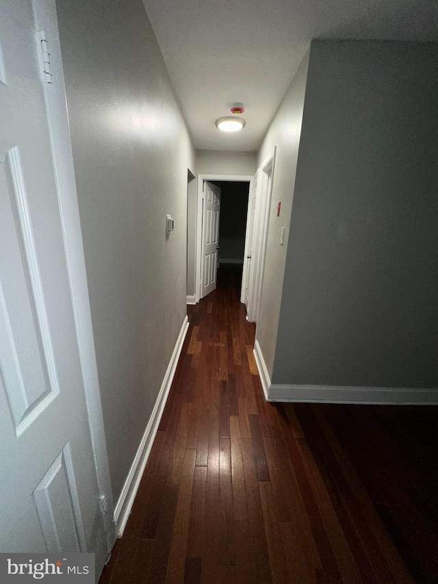 35 Preston Ave, Voorhees, NJ 08043 - corridor featuring dark wood-style floors and baseboards