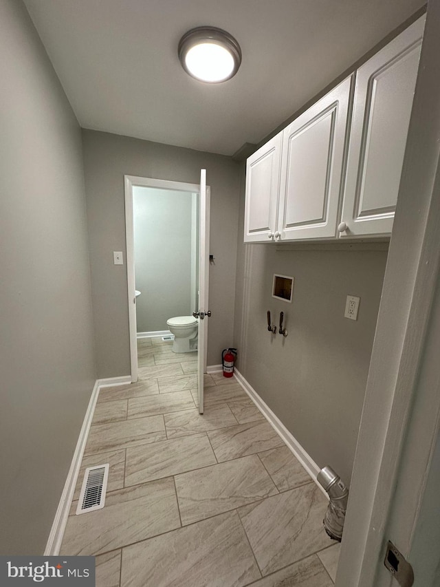 35 Preston Ave, Voorhees, NJ 08043 - washroom with baseboards, cabinet space, hookup for a washing machine, and light marble finish floors