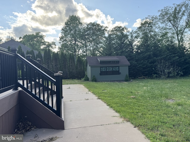 view of green lawn featuring stairs