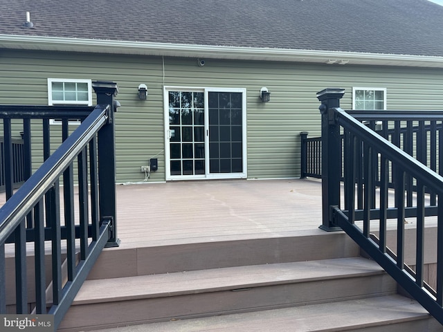 wooden terrace featuring stairway