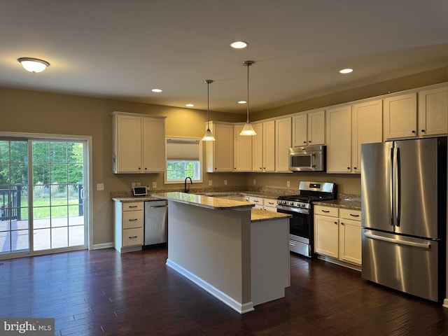 kitchen with stainless steel appliances, dark wood-style flooring, white cabinets, and recessed lighting