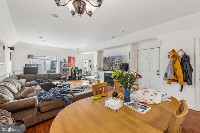 dining area featuring wood finished floors, a chandelier, and recessed lighting