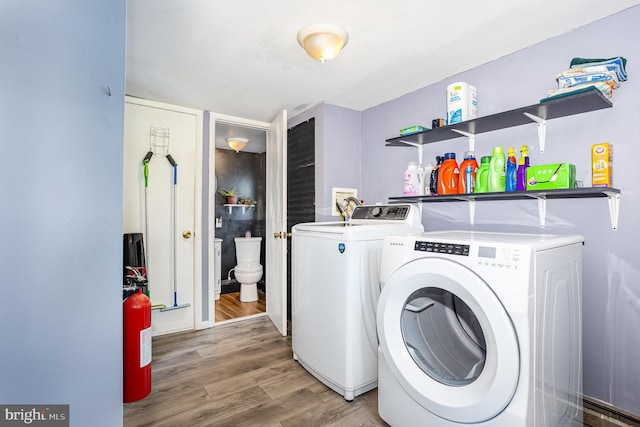 108 Fairfield St, Newville, PA 17241 - washroom with washer and clothes dryer and wood finished floors