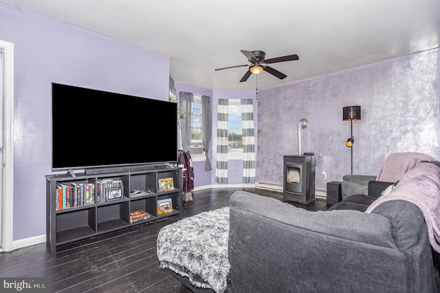 108 Fairfield St, Newville, PA 17241 - living room featuring a ceiling fan, dark wood finished floors, a wood stove, baseboards, and a baseboard radiator