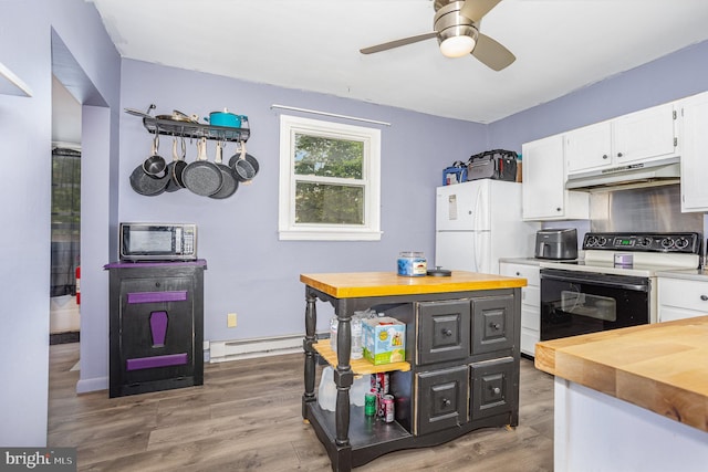 108 Fairfield St, Newville, PA 17241 - kitchen with electric stove, butcher block counters, under cabinet range hood, freestanding refrigerator, and white cabinetry