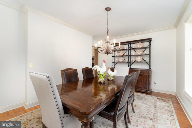 10 Highland Dr, Palmyra, PA 17078 - dining area with a chandelier, light wood-style flooring, crown molding, and baseboards