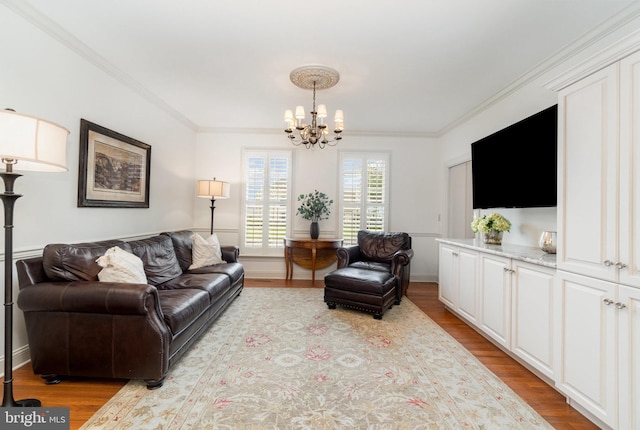 10 Highland Dr, Palmyra, PA 17078 - living room featuring a chandelier, ornamental molding, and light wood finished floors