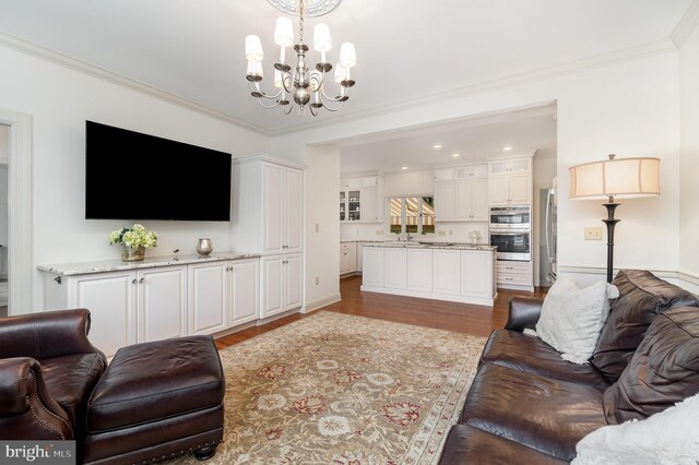 10 Highland Dr, Palmyra, PA 17078 - living room with a chandelier, wood finished floors, crown molding, and baseboards