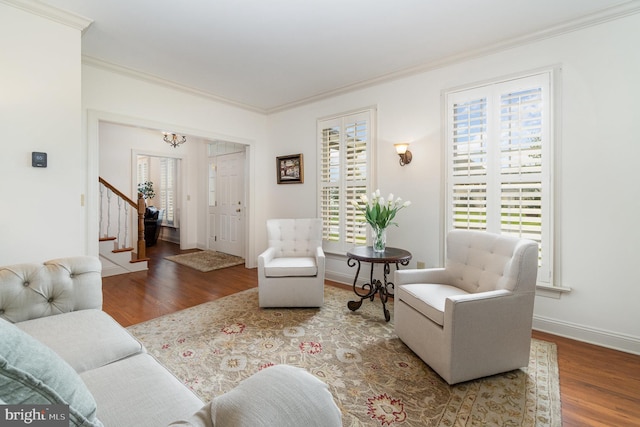 10 Highland Dr, Palmyra, PA 17078 - living room with wood finished floors, plenty of natural light, crown molding, stairs, and a chandelier