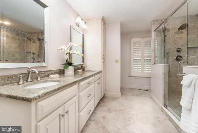 10 Highland Dr, Palmyra, PA 17078 - bathroom with double vanity, a stall shower, and baseboards
