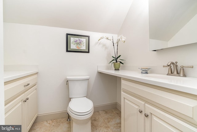 10 Highland Dr, Palmyra, PA 17078 - bathroom featuring vanity, lofted ceiling, toilet, and baseboards