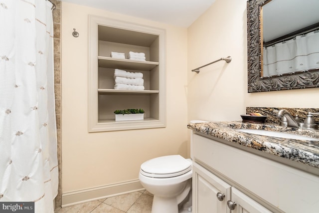 10 Highland Dr, Palmyra, PA 17078 - bathroom with vanity, toilet, tile patterned floors, curtained shower, and built in shelves