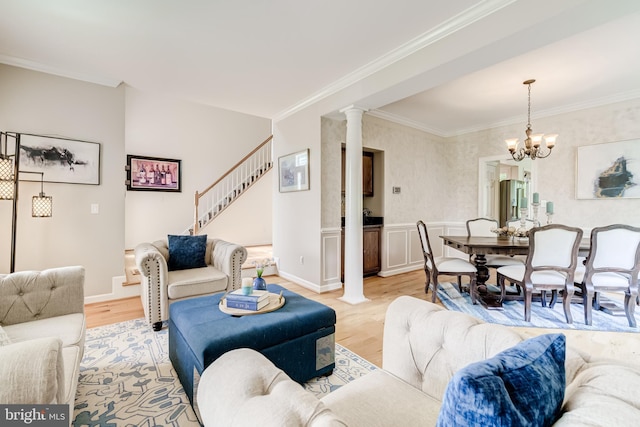 20932 Cox Mills Ct, Ashburn, VA 20147 - living room with light wood finished floors, crown molding, ornate columns, stairway, and a chandelier