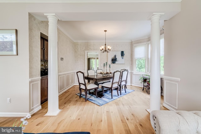 20932 Cox Mills Ct, Ashburn, VA 20147 - dining space with plenty of natural light, light wood-type flooring, decorative columns, crown molding, and a chandelier
