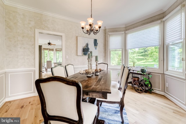20932 Cox Mills Ct, Ashburn, VA 20147 - dining space with a decorative wall, light wood-style flooring, crown molding, a chandelier, and a wainscoted wall