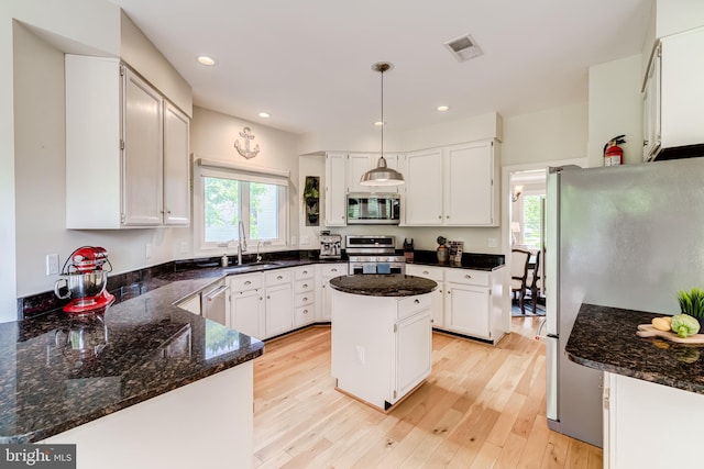 20932 Cox Mills Ct, Ashburn, VA 20147 - kitchen featuring stainless steel appliances, plenty of natural light, light wood-type flooring, white cabinets, and recessed lighting