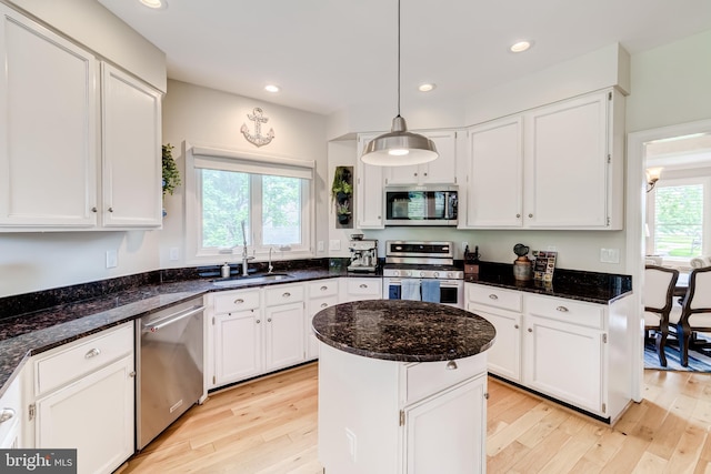20932 Cox Mills Ct, Ashburn, VA 20147 - kitchen with stainless steel appliances, light wood finished floors, white cabinets, and recessed lighting