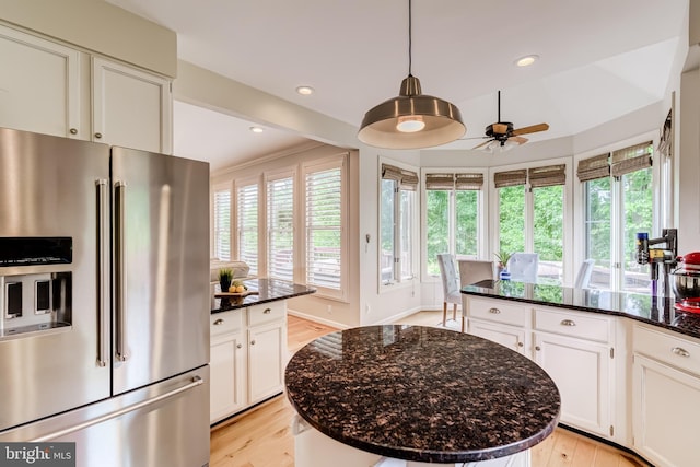 20932 Cox Mills Ct, Ashburn, VA 20147 - kitchen with high end fridge, light wood-type flooring, a ceiling fan, dark stone countertops, and recessed lighting