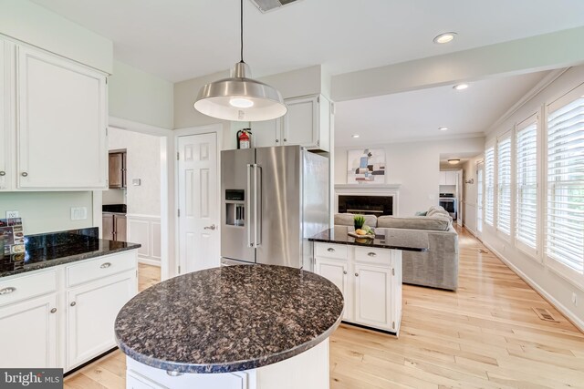 20932 Cox Mills Ct, Ashburn, VA 20147 - kitchen with high end refrigerator, a center island, light wood-type flooring, white cabinets, and a fireplace
