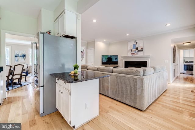 20932 Cox Mills Ct, Ashburn, VA 20147 - kitchen with stove, freestanding refrigerator, light wood-type flooring, white cabinets, and crown molding