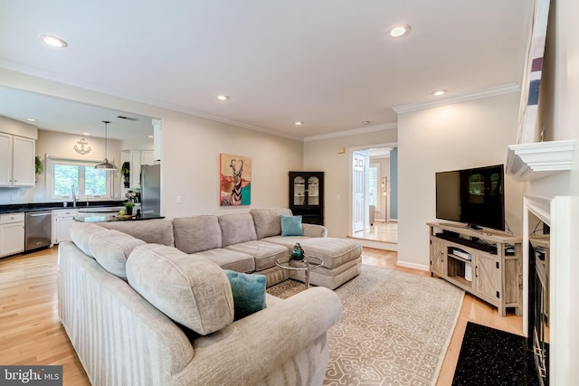 20932 Cox Mills Ct, Ashburn, VA 20147 - living area with light wood finished floors, recessed lighting, and ornamental molding