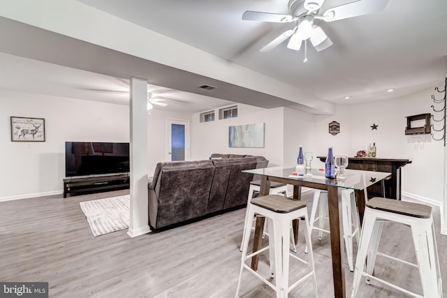20932 Cox Mills Ct, Ashburn, VA 20147 - dining room featuring a ceiling fan, light wood finished floors, and a dry bar