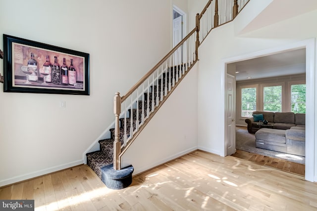 20932 Cox Mills Ct, Ashburn, VA 20147 - stairs featuring hardwood / wood-style flooring and baseboards